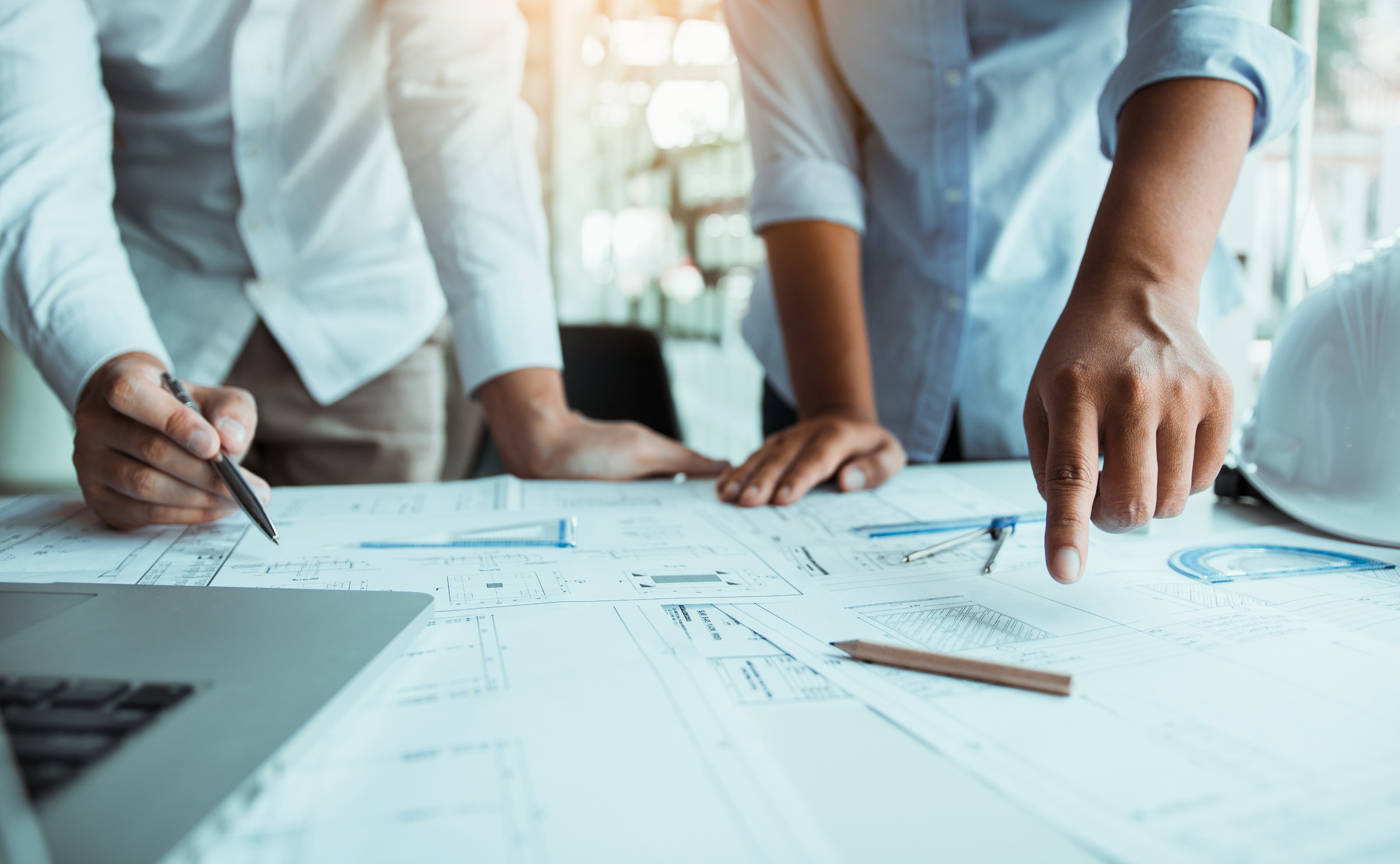 Engineers reviewing plans at a work table