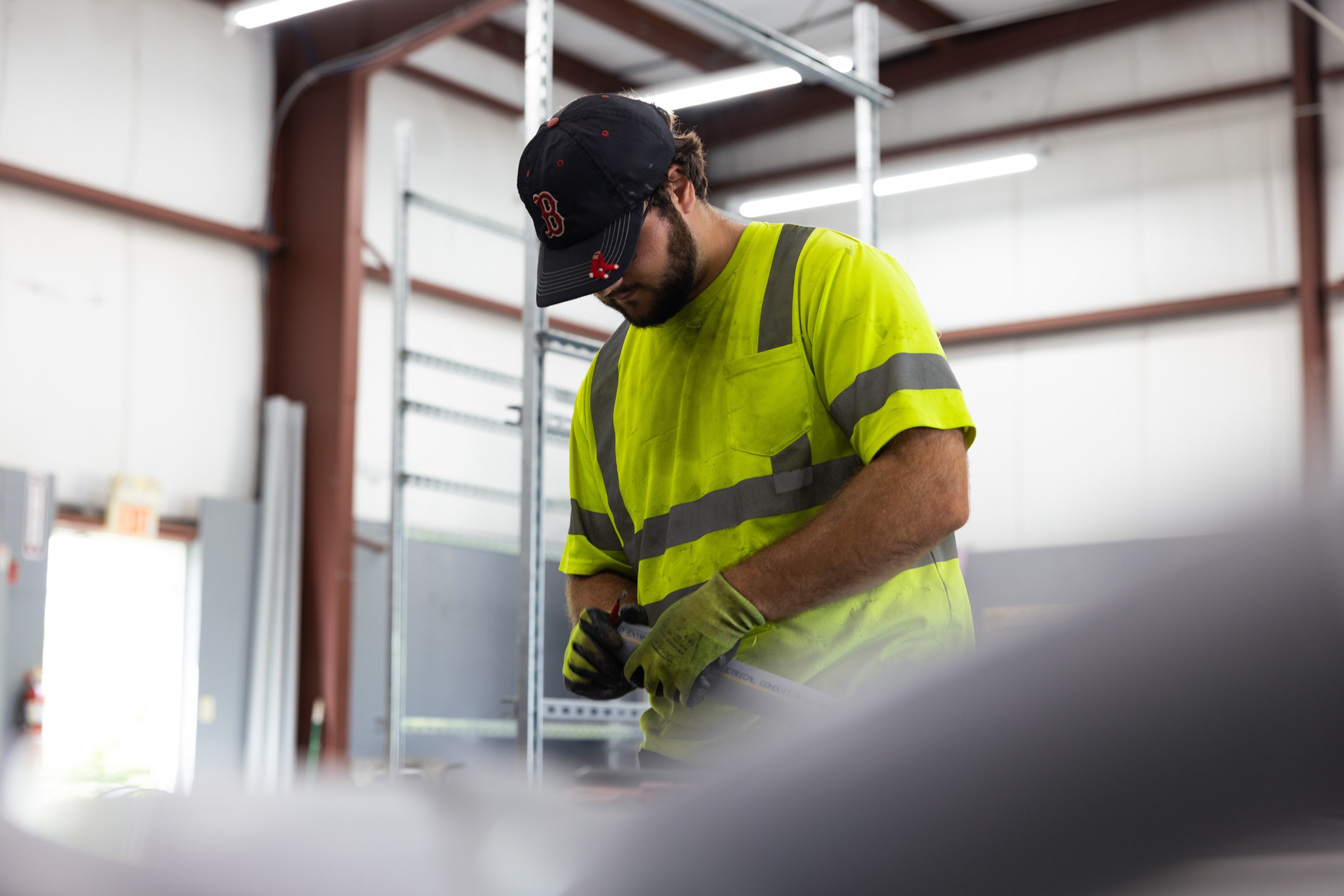 Electrician working on industrial electrical equipment