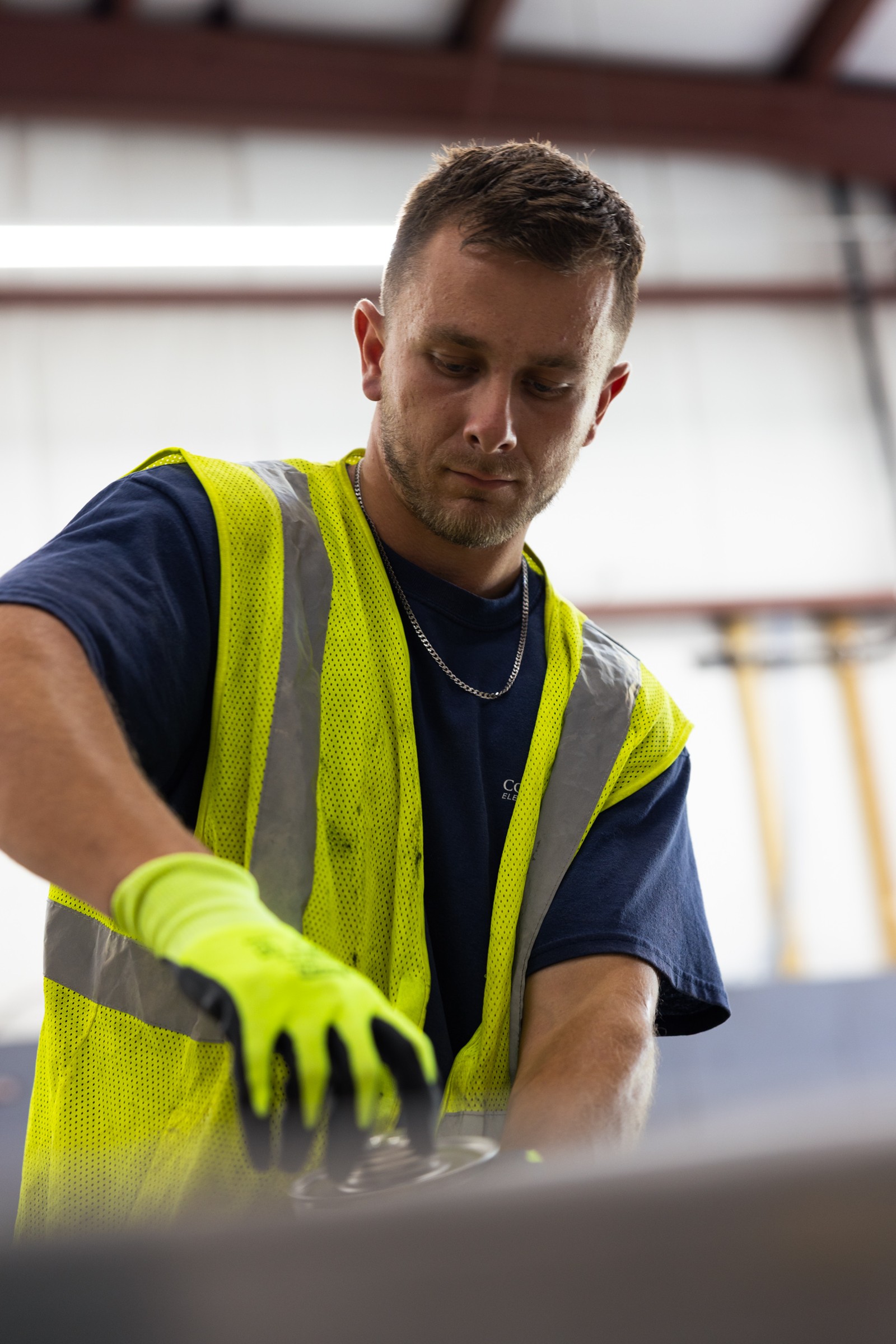Electrician wearing a safety vest