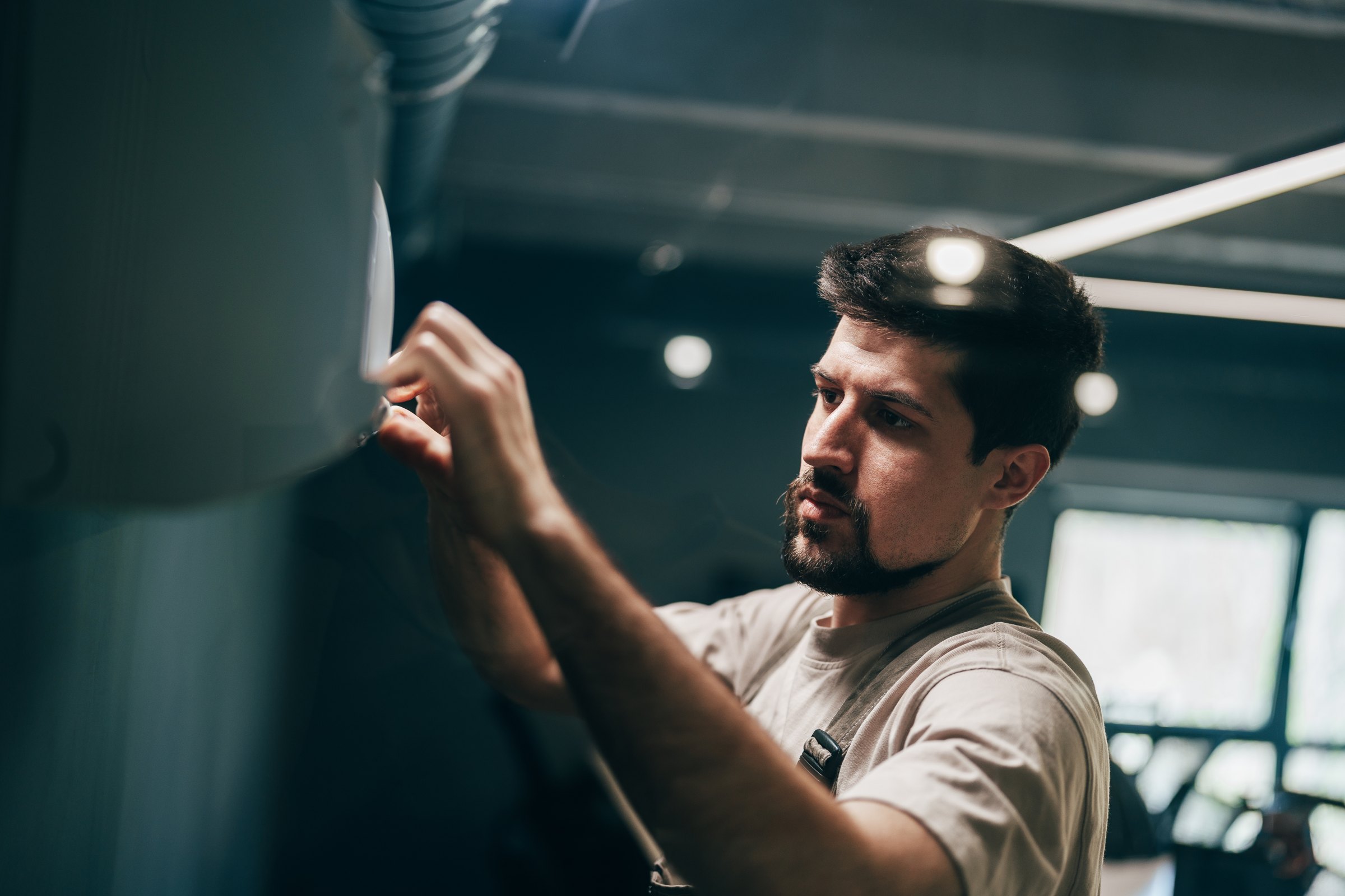 Technician servicing equipment