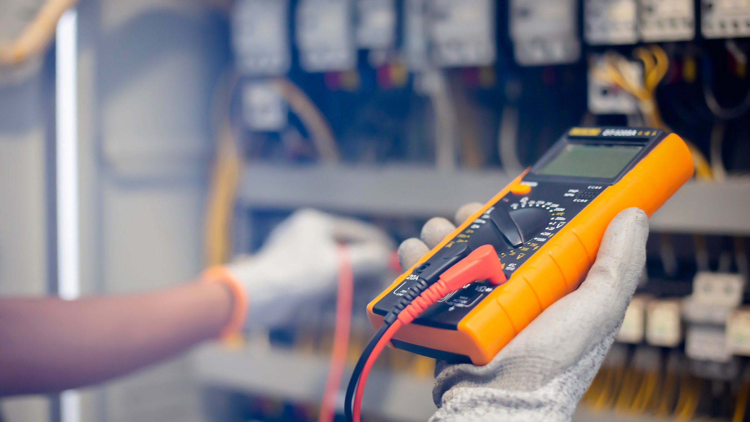 Technician measuring an electrical circuit